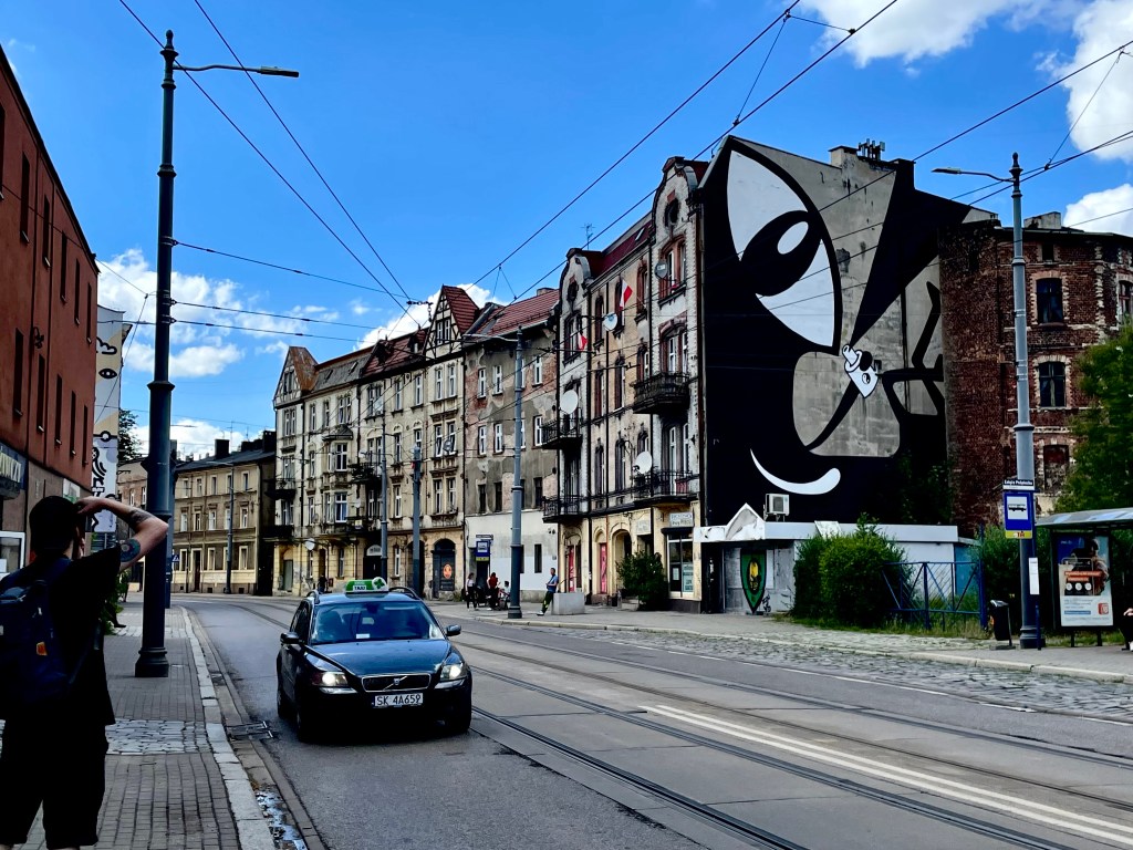 Mural by Noriaki with watcher in Katowice