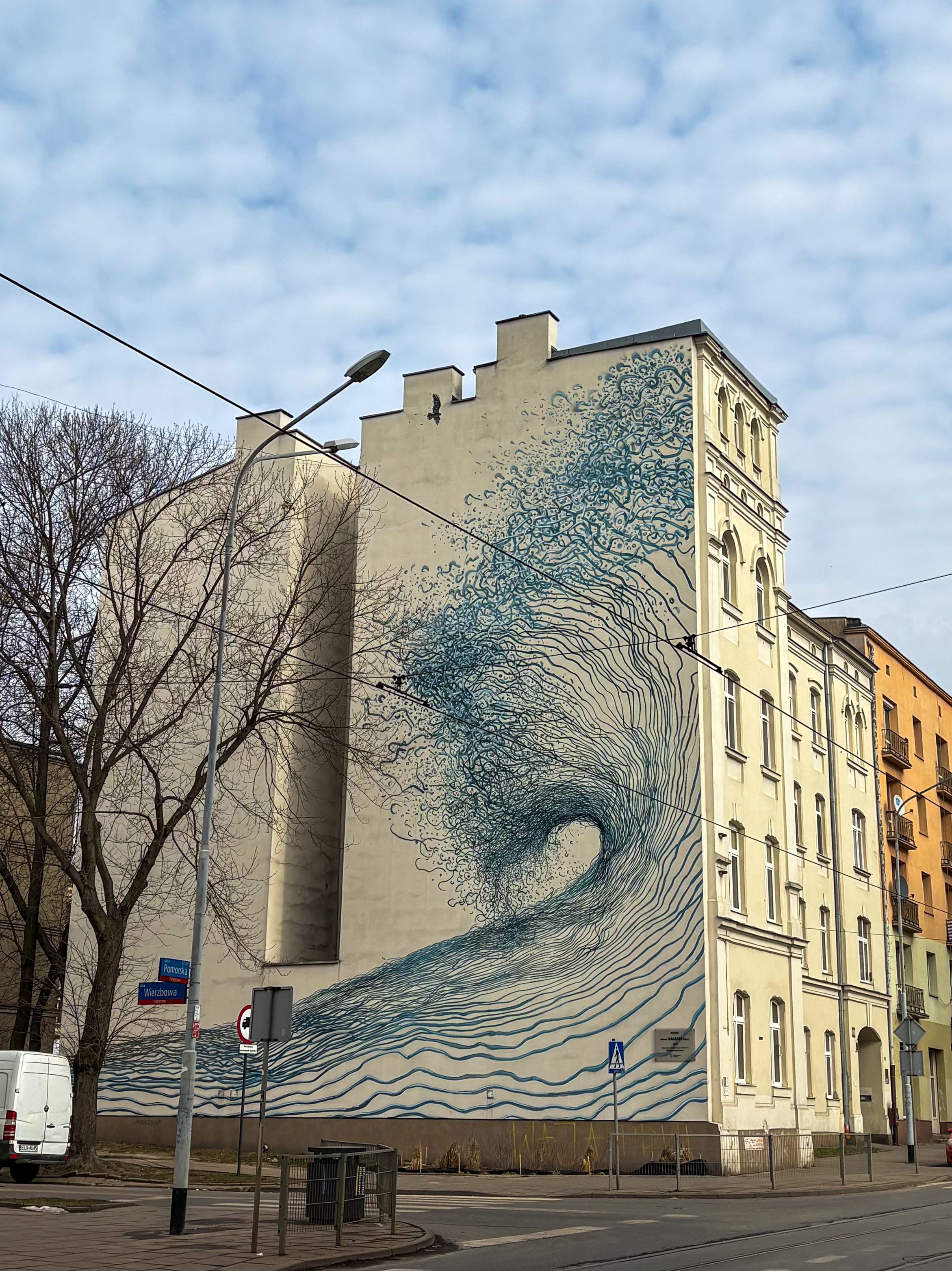 Mural by daleast in Lodz with the wave