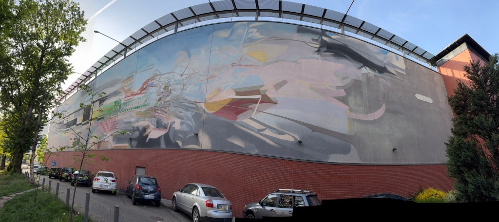giant mural on the wall of Galeria Lodzka by Proembrion