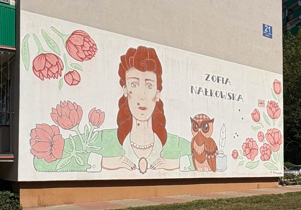 mural with a women and an owl with flowers