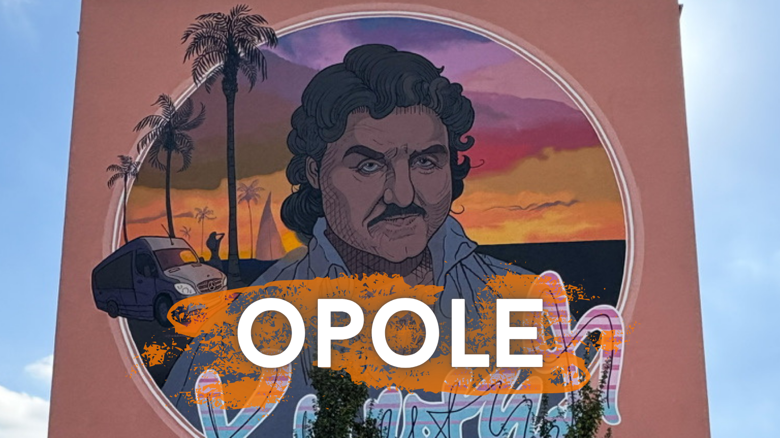 A stylized mural portrait of a man with dark curly hair and a mustache set against a sunset background with palm trees. The word “OPOLE” appears in bold white letters on the right side of the image.