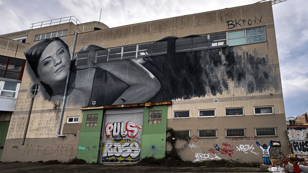 mural by BK FOXX with woman