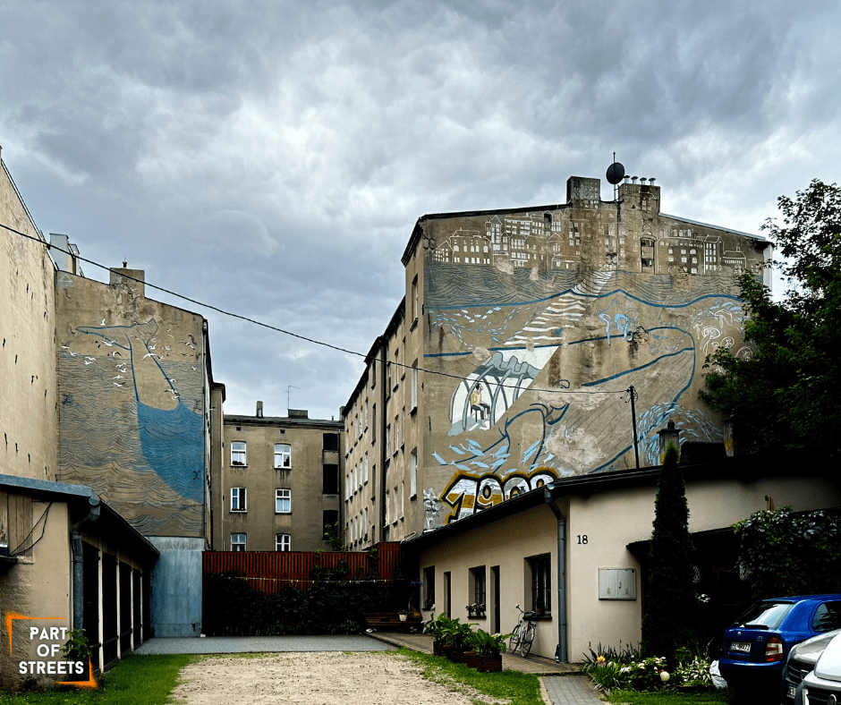 Jonas mural on a tenement building in Łódź, Poland.