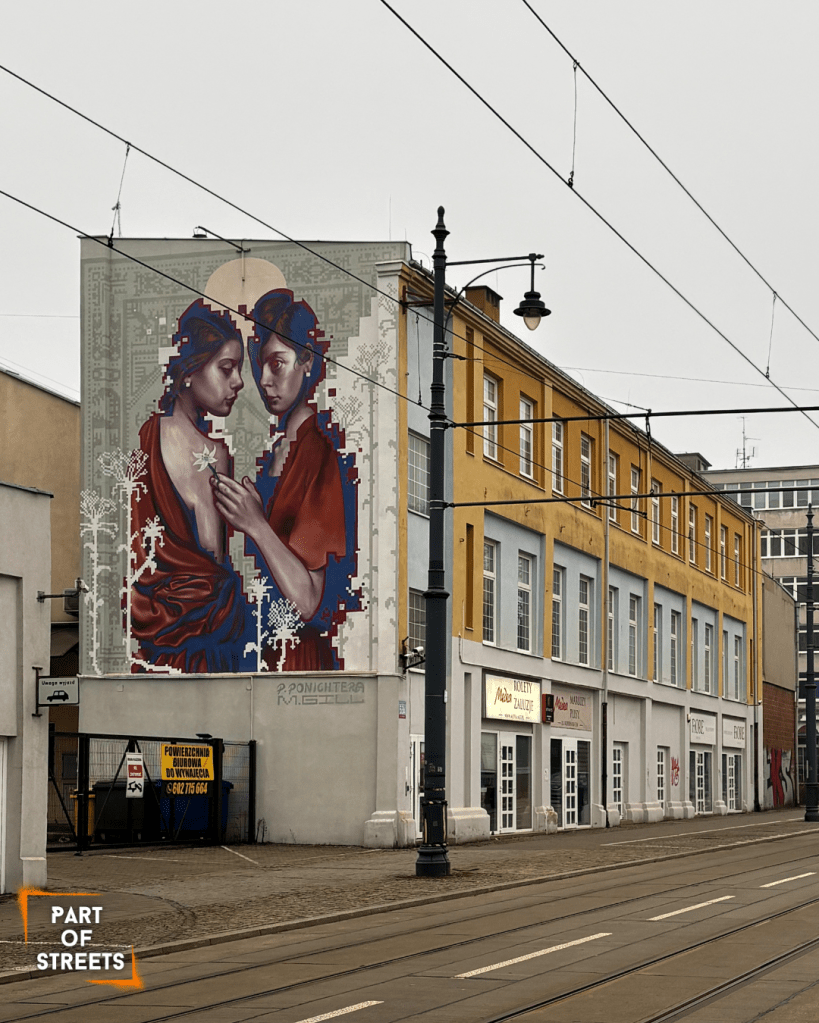 Ponichtera and Gill mural with two women on a tenement building in Łódź, Poland.