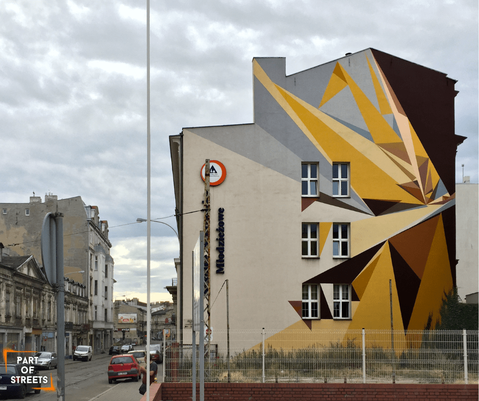 pener mural on a tenement building in Łódź, Poland.