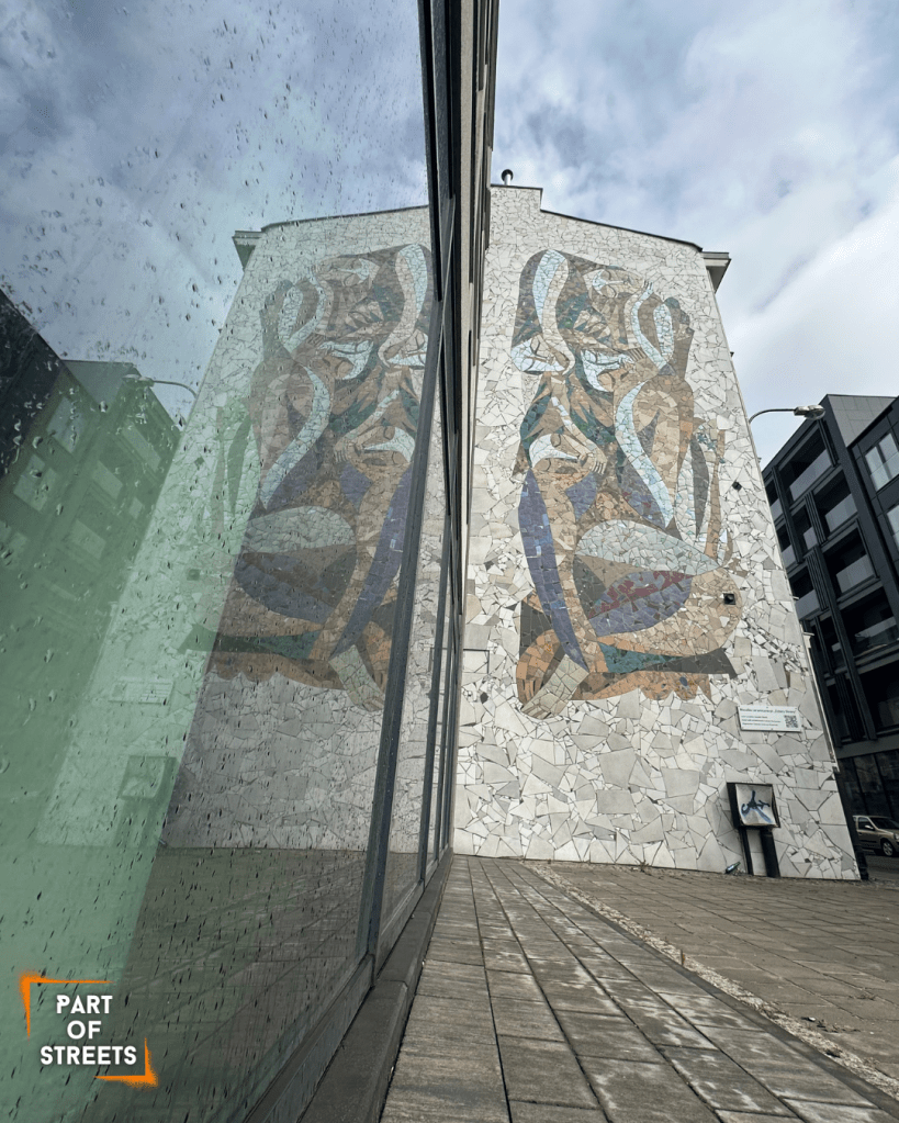 mosaic mural by Otecki on a tenement building in Łódź, Poland.