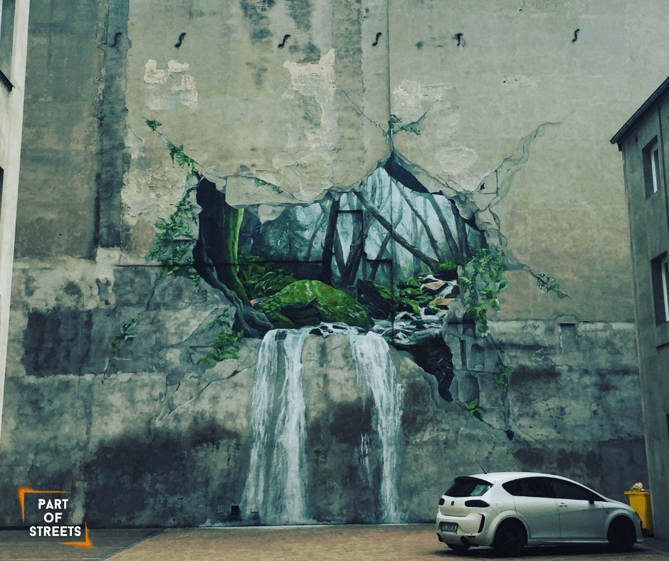 mural with waterfall on a tenement building in Łódź, Poland.
