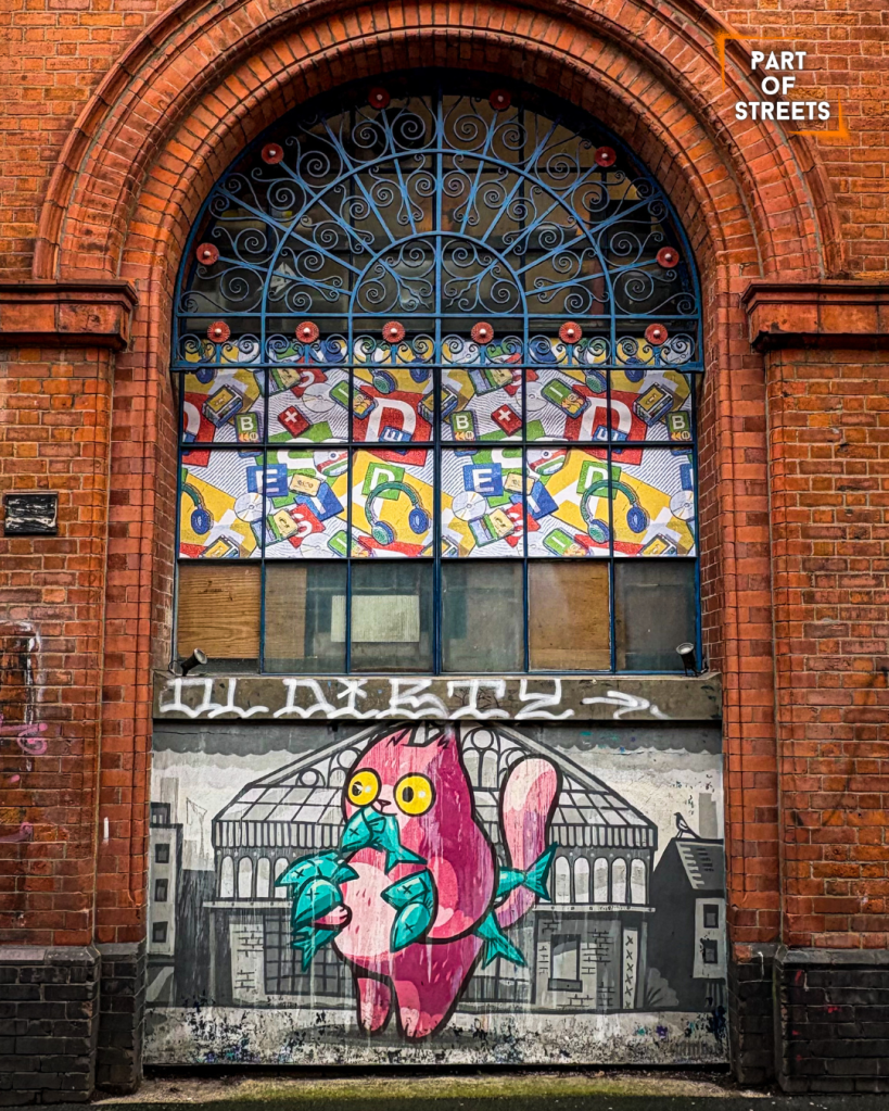 The Hammo mural in Manchester Northern Quarter featuring a cat with fish.